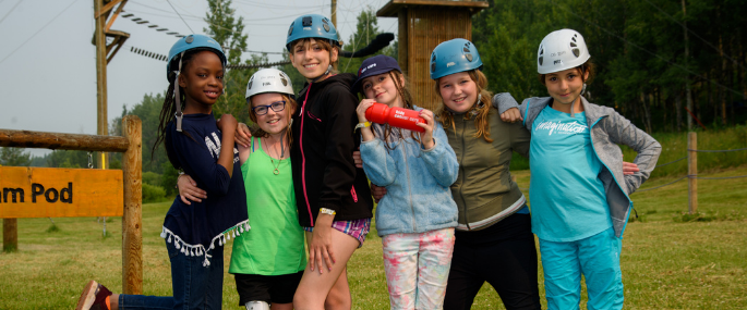 Kids at the high ropes course at Camp Kindle